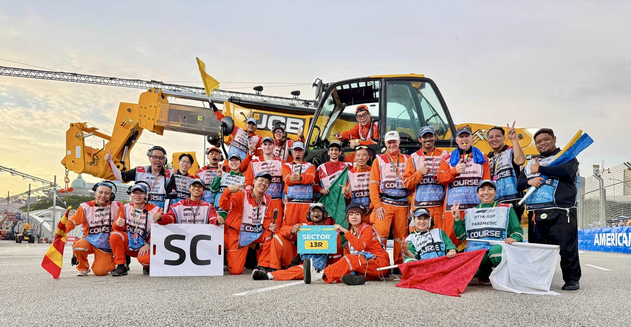 A Formula 1 team working together trackside